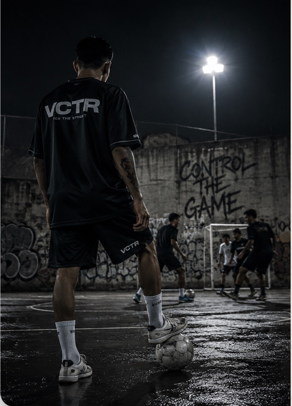 Street game in motion — VCTR player with ball under floodlights
